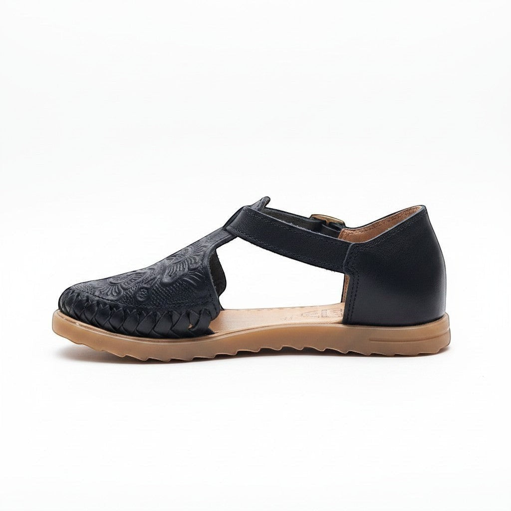 ARTESANALRENVAL black synthetic leather espadrille sandal with embossed detail and buckle strap.