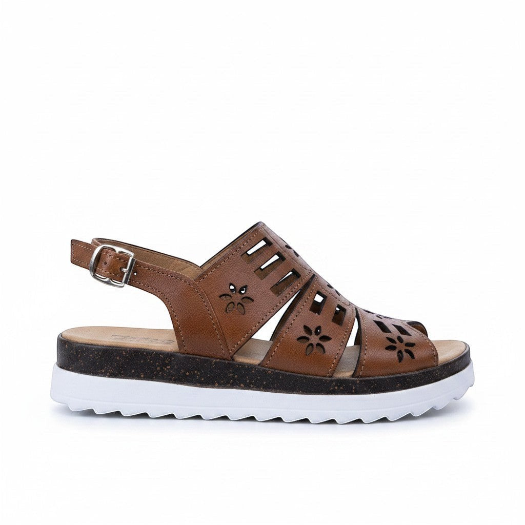 ARTESANALRENVAL brown synthetic leather huarache sandal with floral cutouts and adjustable ankle strap.