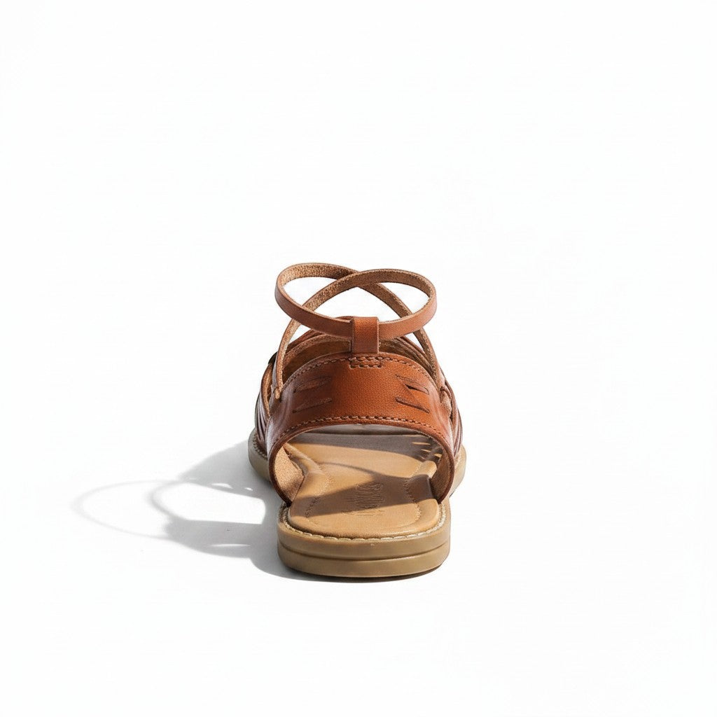 ARTESANALRENVAL brown leather espadrille sandal with floral engraving and ankle straps.