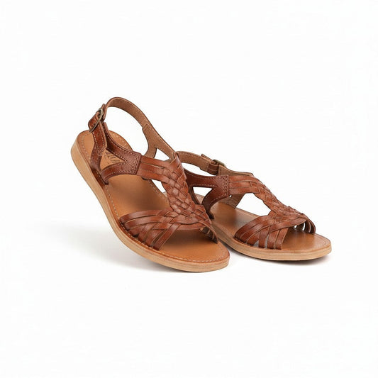 ARTESANALRENVAL traditional brown leather huarache sandals with woven straps and buckle closure.