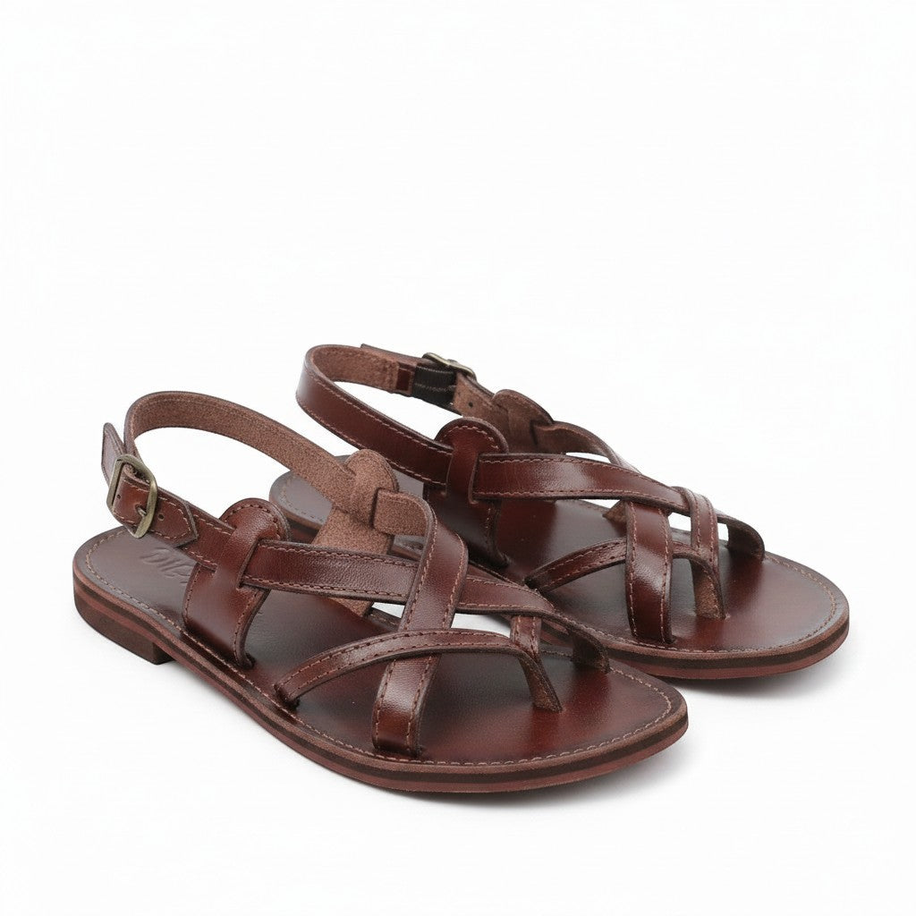 ARTESANALRENVAL dark brown leather huarache sandals with criss-cross straps and buckle closure. Handmade in Mexico.