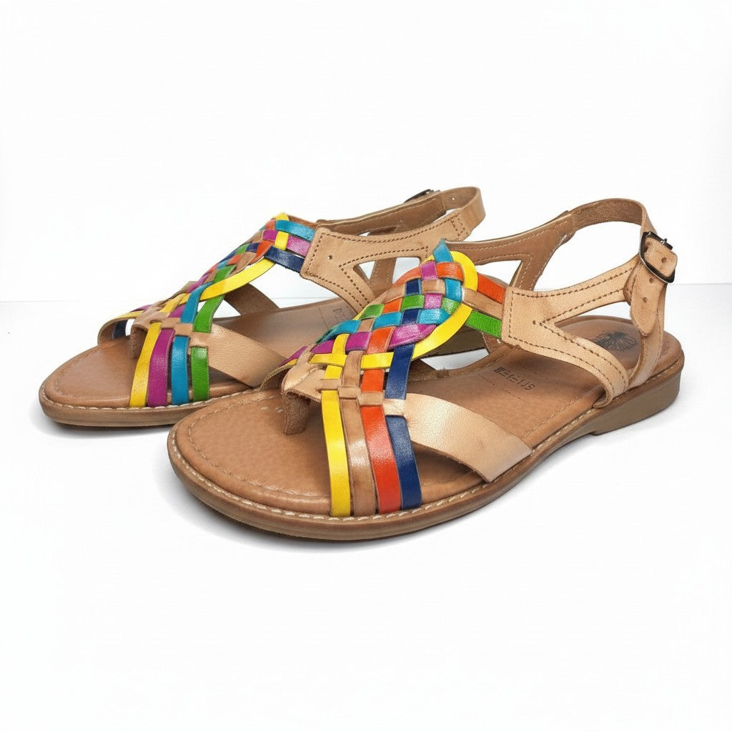 ARTESANALRENVAL tan leather huarache sandals with colorful woven straps and floral embroidery. Adjustable ankle strap with gold buckle.
