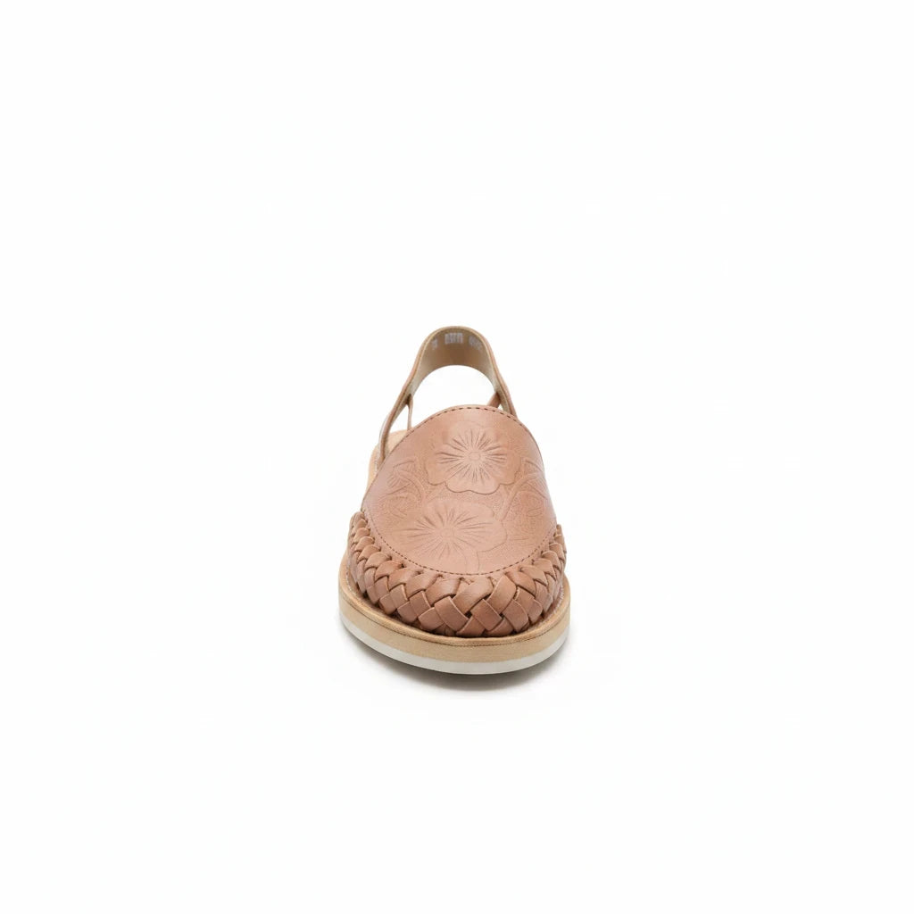 ARTESANALRENVAL nude leather sandals with handcrafted tulip floral embossing and woven detailing on a white background