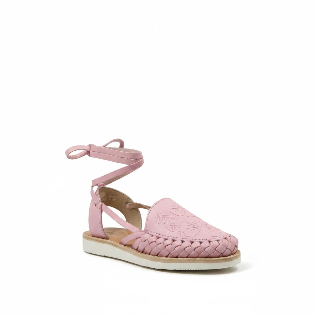 ARTESANALRENVAL pink leather huarache sandals with tulip cutout design, ankle tie straps, and cushioned sole.