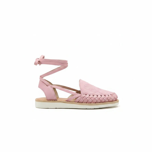 ARTESANALRENVAL pink leather huarache sandals with tulip cutout design, lace-up ankle straps, and cushioned sole.