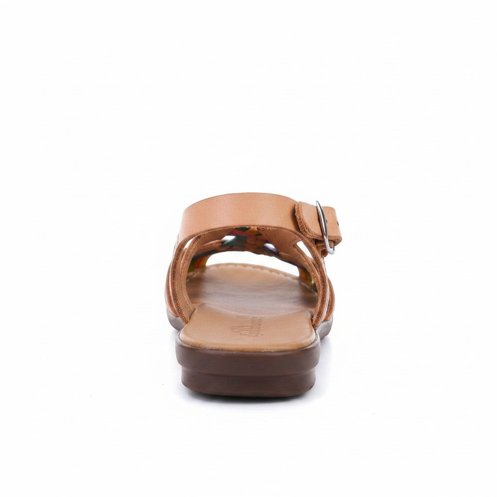 ARTESANALRENVAL tan leather huarache sandal with floral embroidery and adjustable ankle strap with gold buckle.