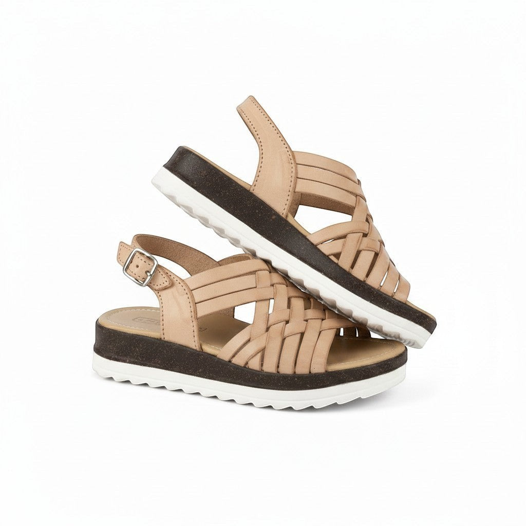 ARTESANALRENVAL tan leather woven huarache sandals with buckle strap and platform sole.