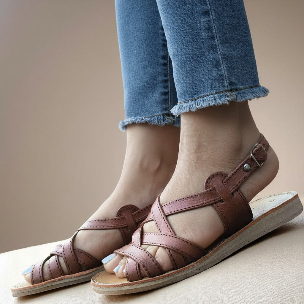 ARTESANALRENVAL tan leather huarache sandals with criss-cross straps and ankle buckle. Handmade Mexican footwear.