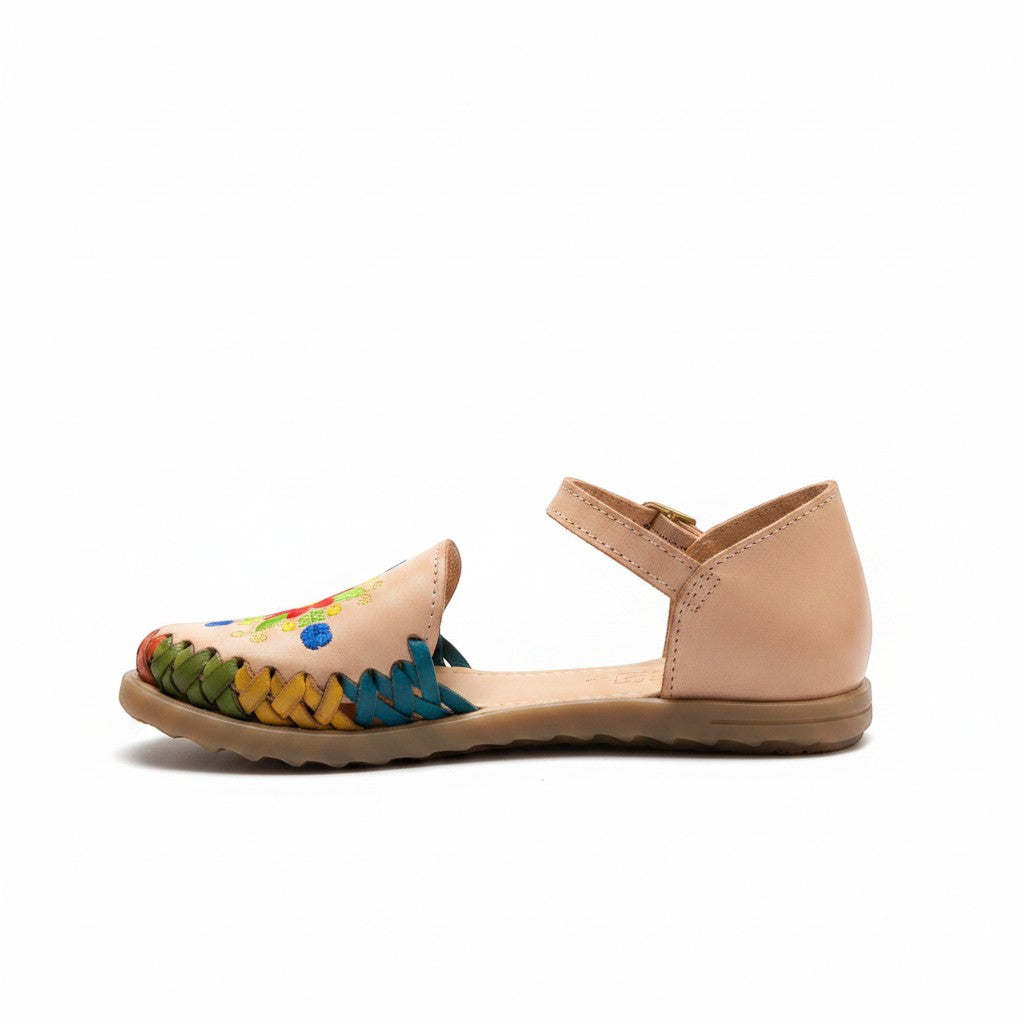 ARTESANALRENVAL tan leather huarache sandals with colorful embroidered floral design and braided detail.