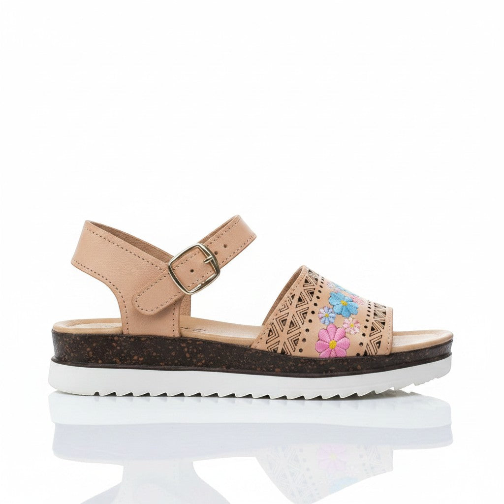 ARTESANALRENVAL tan leather huarache sandals with laser-cut geometric patterns and colorful floral embroidery. Adjustable ankle strap and platform sole.