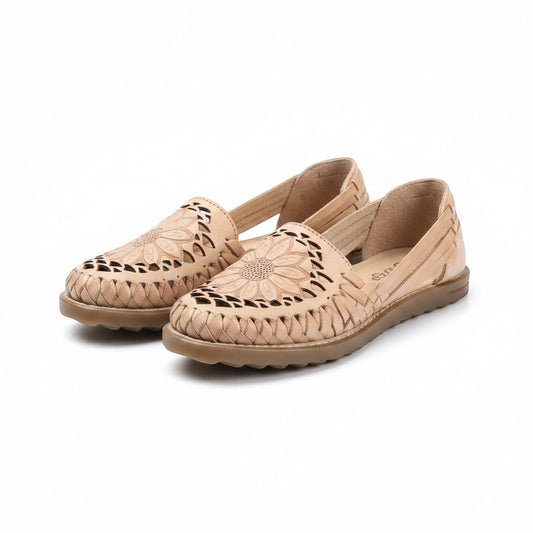 ARTESANALRENVAL tan leather huaraches with floral cutouts and woven details. Flat sole, open sides.