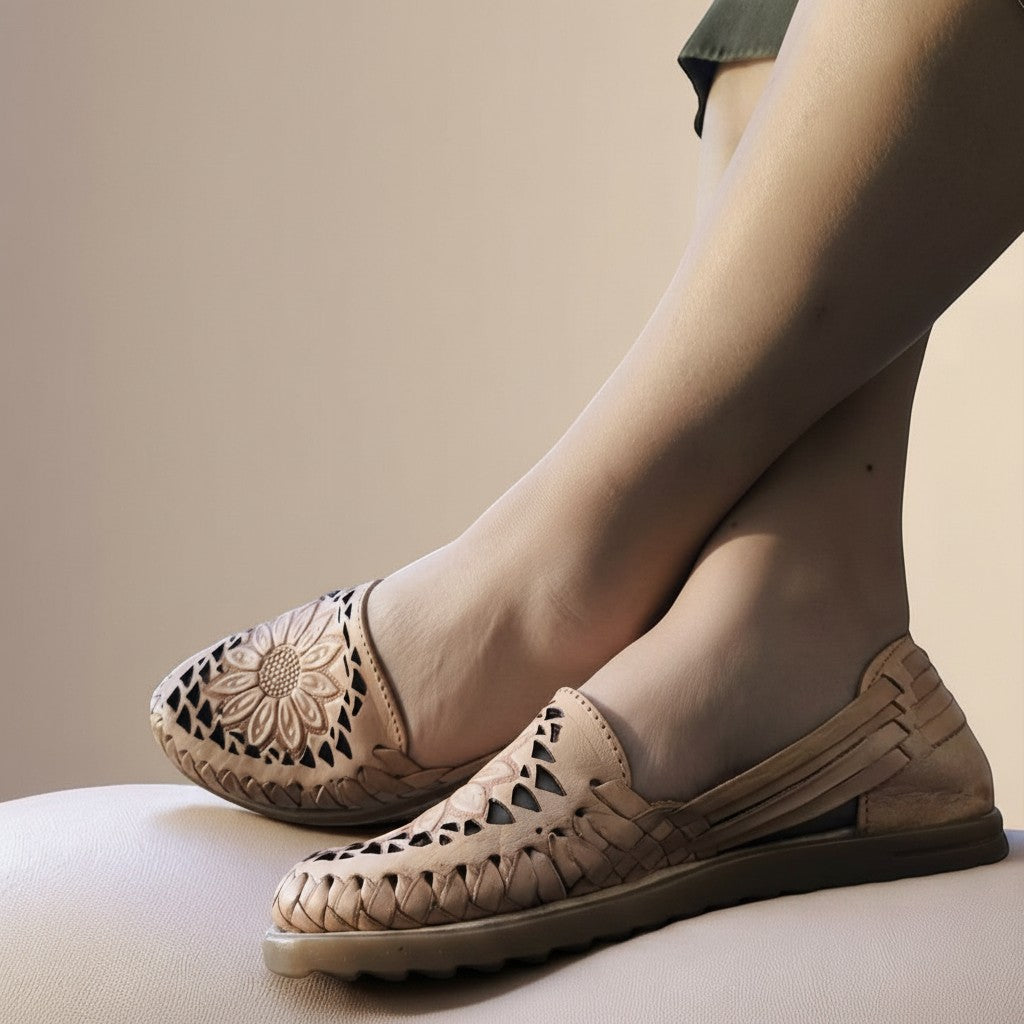 ARTESANALRENVAL tan leather huaraches with woven detail and sunflower design on toe. Women's handmade Mexican sandals.