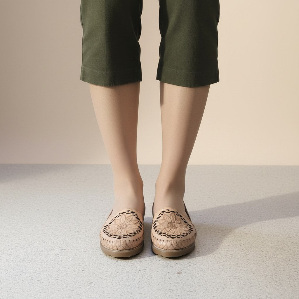 ARTESANALRENVAL tan leather huaraches with woven detail and sunflower design on toe. Women's artisanal Mexican footwear.