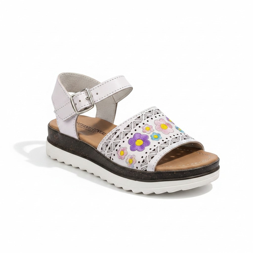 ARTESANALRENVAL white leather huarache sandals with embroidered floral pattern and buckle strap.