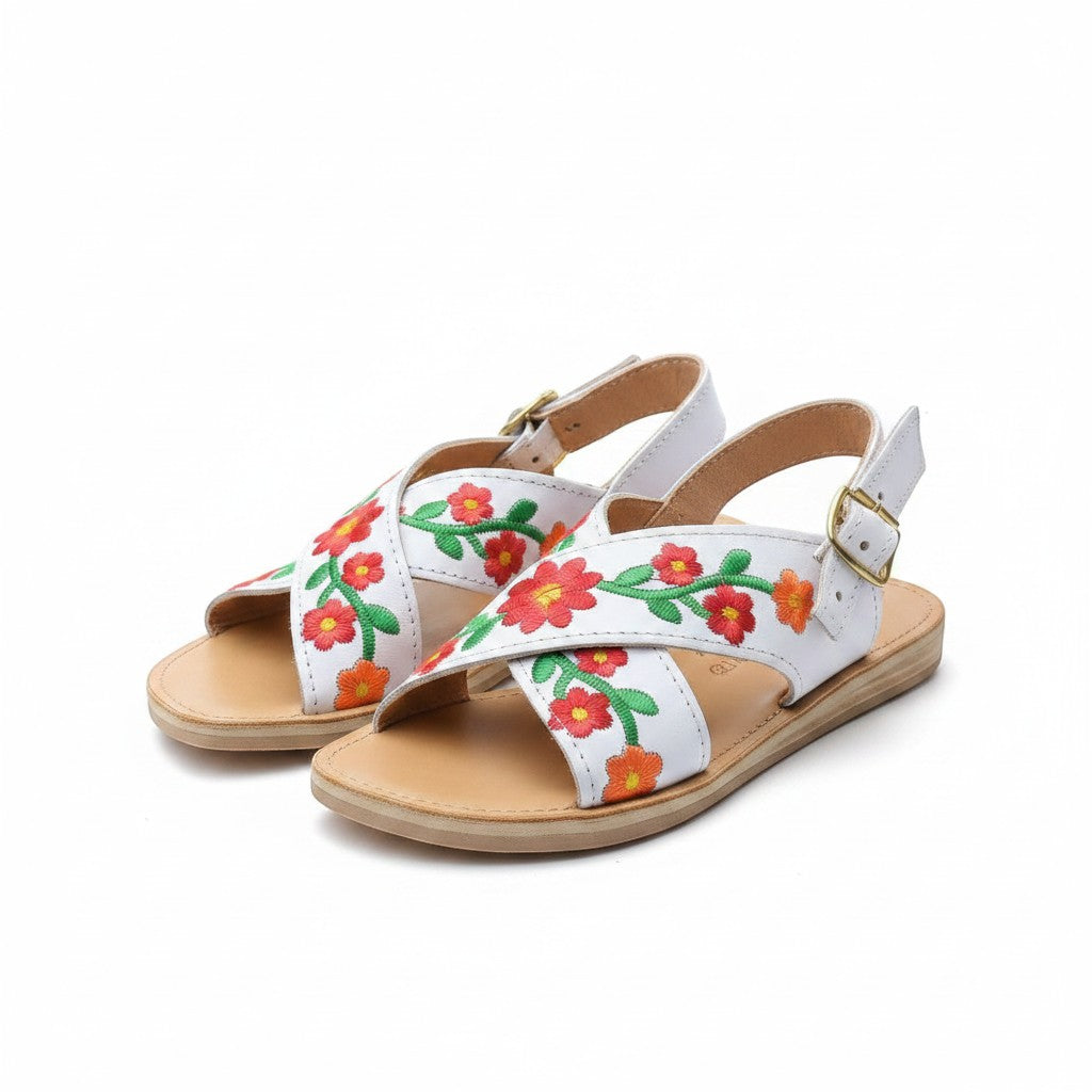 ARTESANALRENVAL white leather huarache sandals with red and orange floral embroidery and adjustable ankle strap.