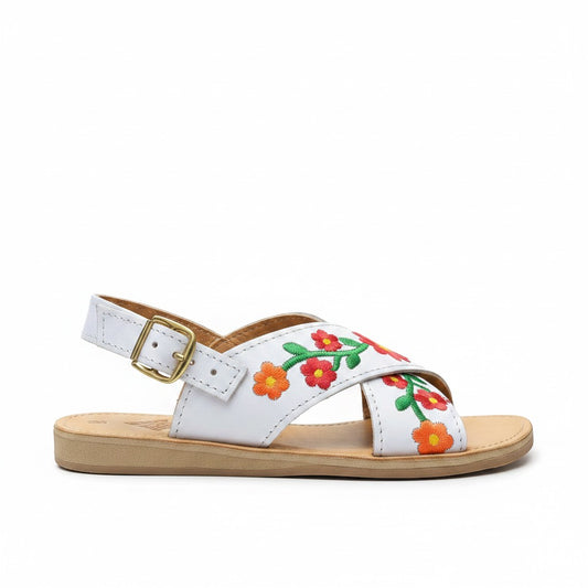 ARTESANALRENVAL white leather huarache sandals with vibrant floral embroidery and gold buckle.