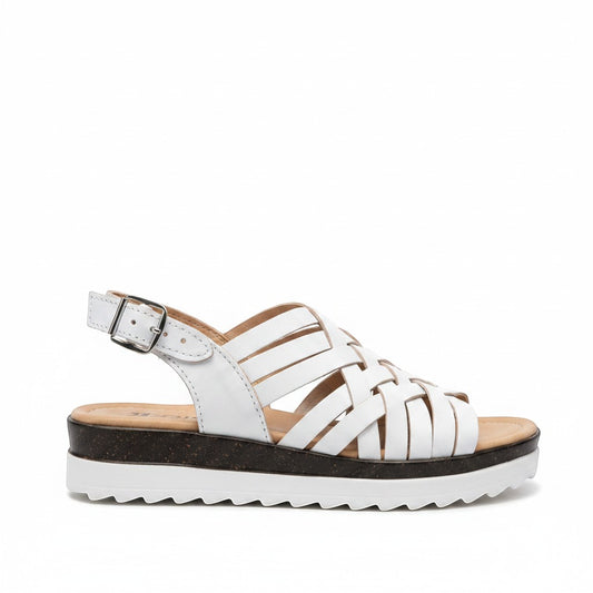 ARTESANALRENVAL white leather woven huarache sandals with buckle strap and platform sole.