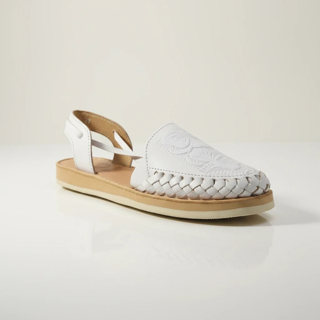 ARTESANALRENVAL white leather huarache sandals with hand-woven details and tulip floral embossing on a flat sole